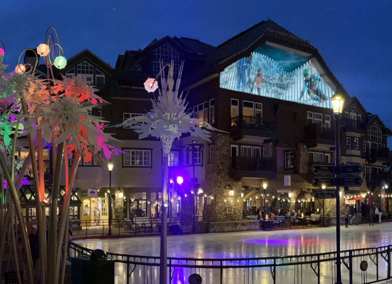 Image of the clock tower in Beaver Creek, CO showing a frame from the nightly projection show